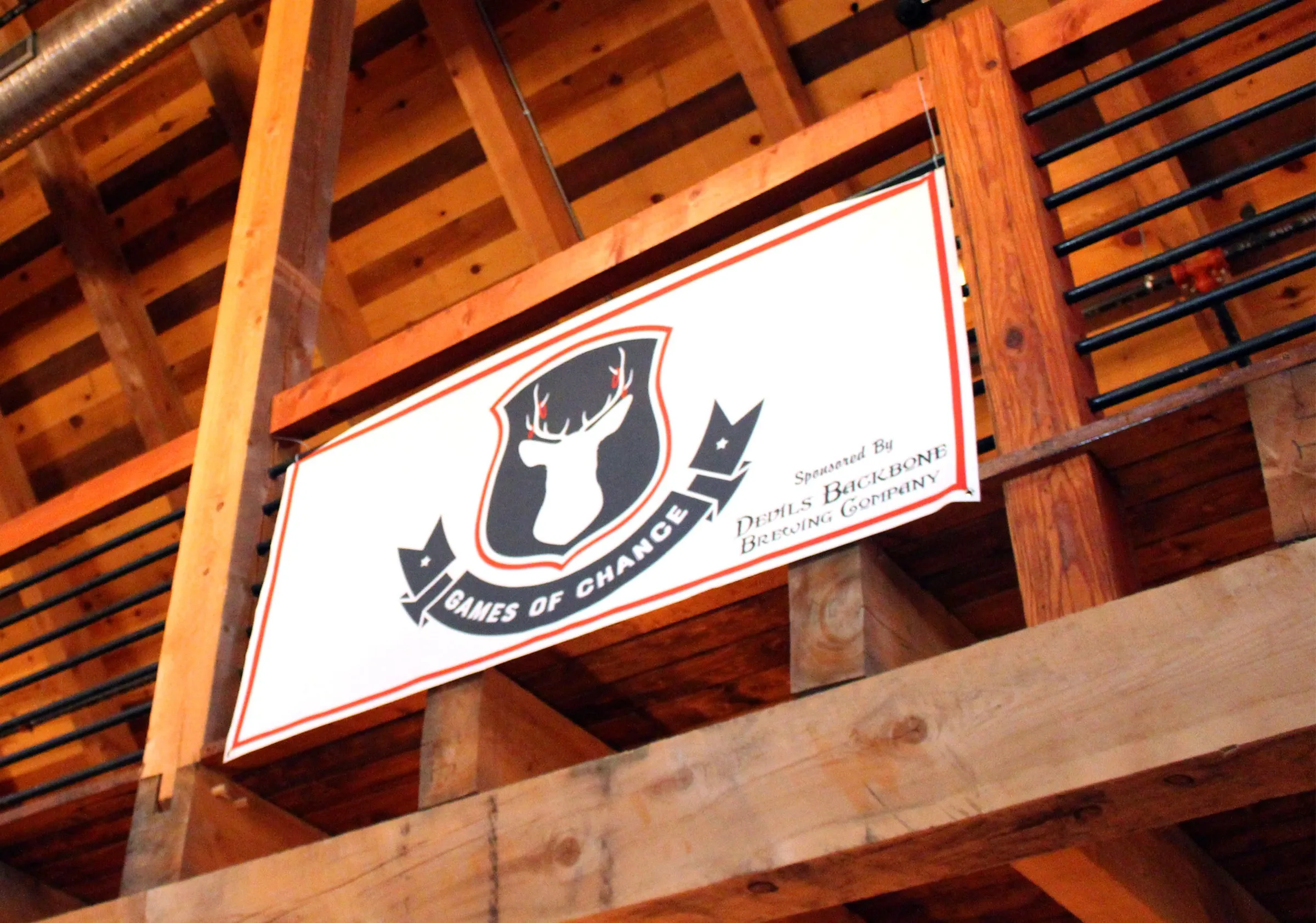 The Games of Chance sign hanging in the barn
