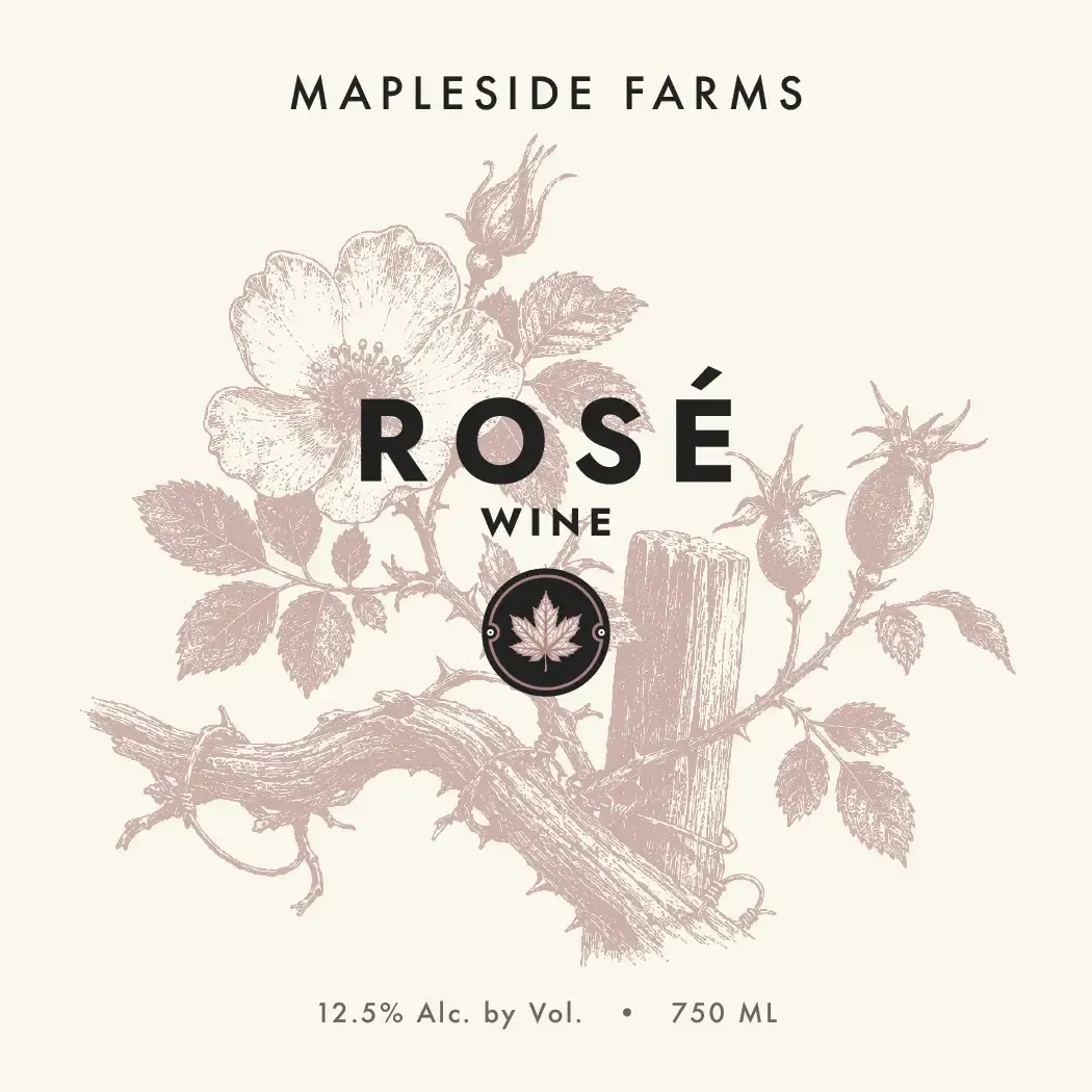 Rosé label: a wild rose on the branch, engraved in dusty pink on cream