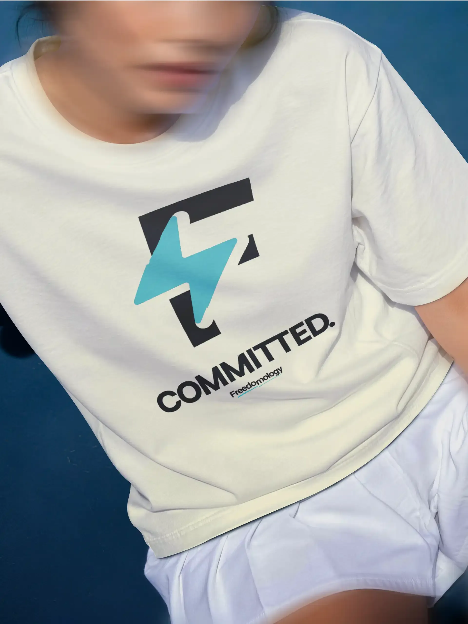 White Committed tee with the large F mark