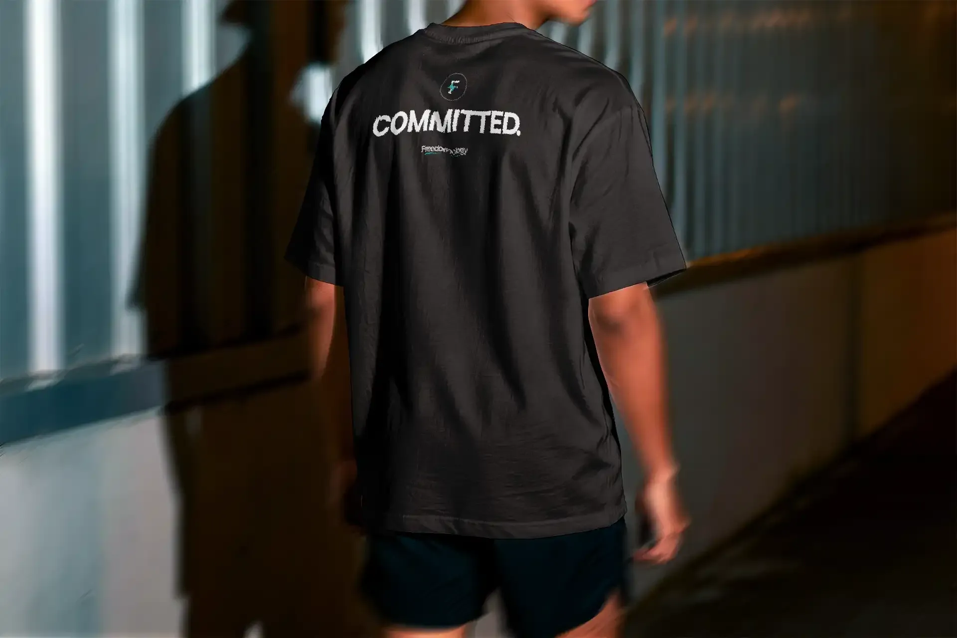 Committed tee, back, on a runner walking away