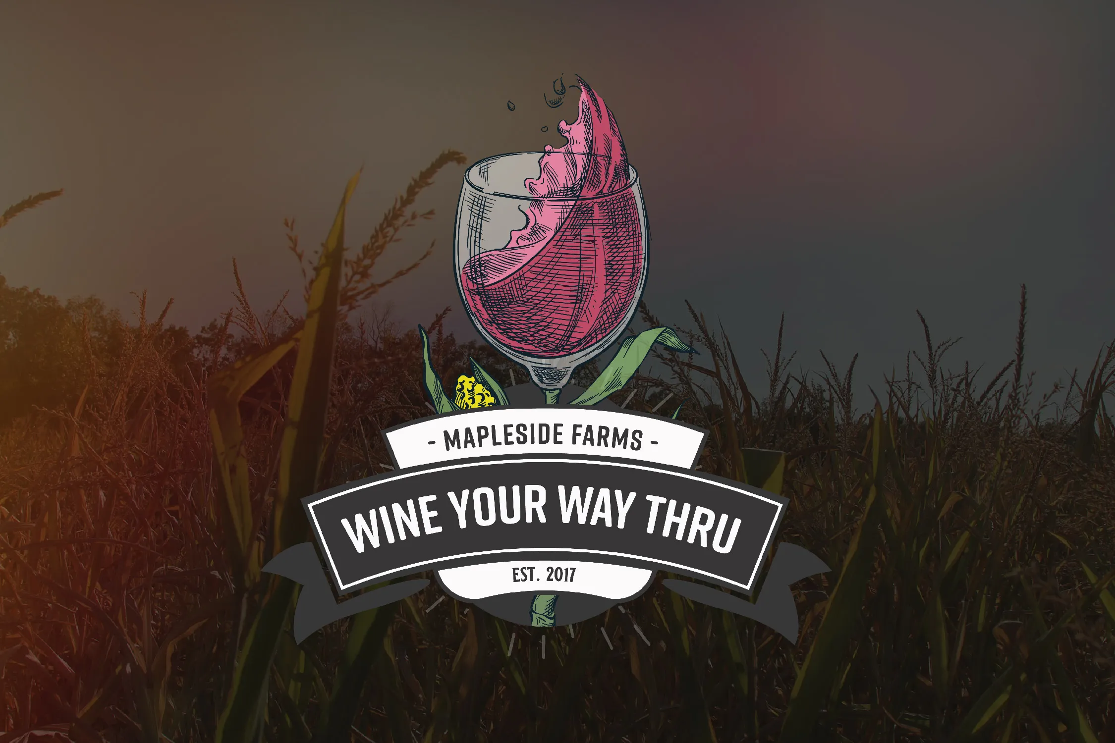 The Wine Your Way Thru mark over a corn field at dusk: a wine glass drawn as a corn husk